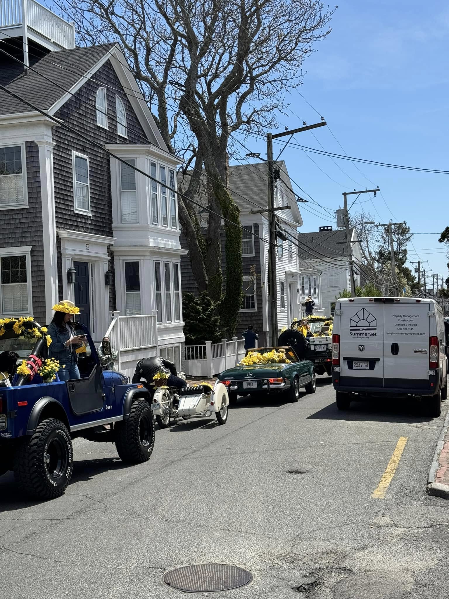 Custom white pergola and deck on Nantucket shingled home